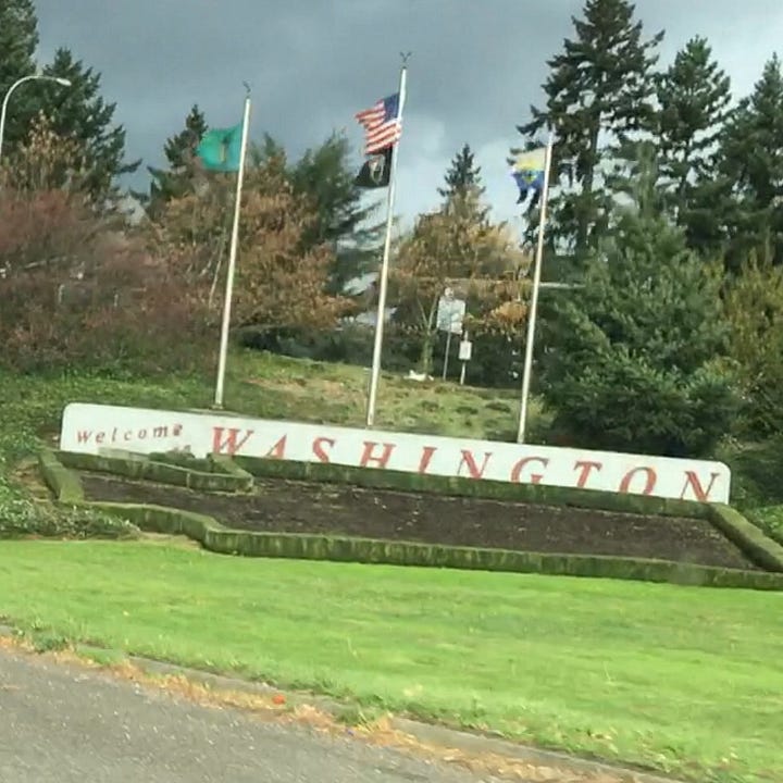 State-line signs for Washington from 2015 and 2023