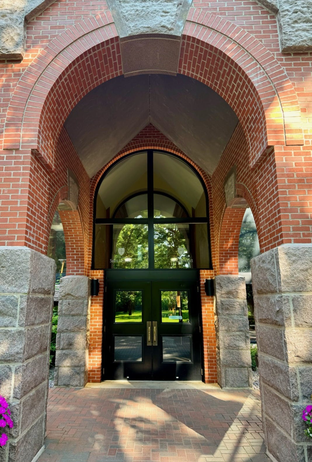glass doors under a brick portico glass doors under a brick portico