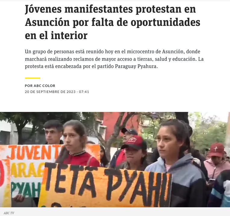 A group of people holding signs

Description automatically generated