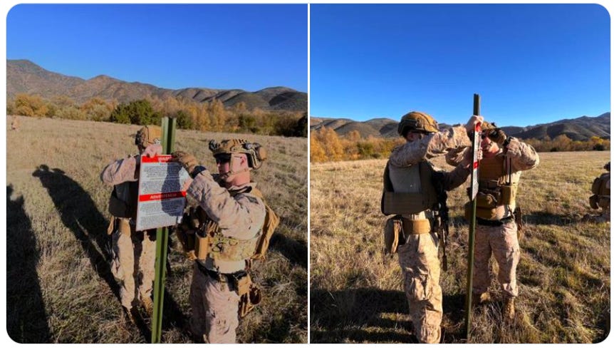 Soldiers erect signs designating a “National Defense Area” along the California border with Mexico.