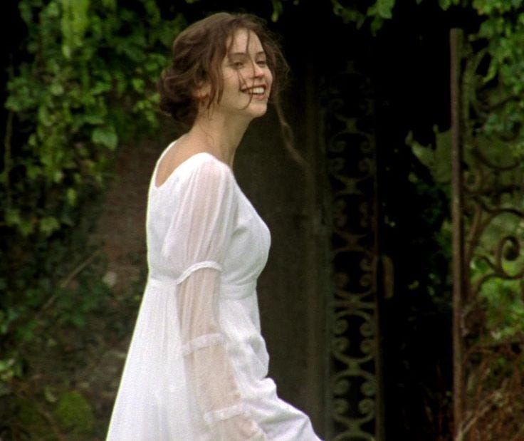Catherine Morland in a white dress with her hair a mess from playing. 