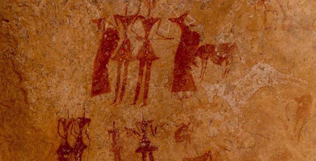 a picture of a group of people on a rock