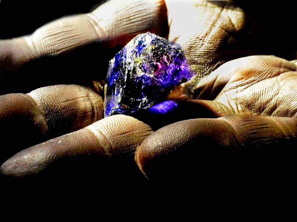 Vintage black and white photo showcasing early tanzanite mining operations in Tanzania, reflecting the rich history of tanzanite discovery Vintage black and white photo showcasing early tanzanite mining operations in Tanzania, reflecting the rich history of tanzanite discovery