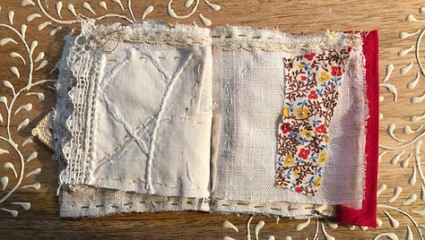 Tiny books and bunting, hand stitched from colorful vintage baby clothes.