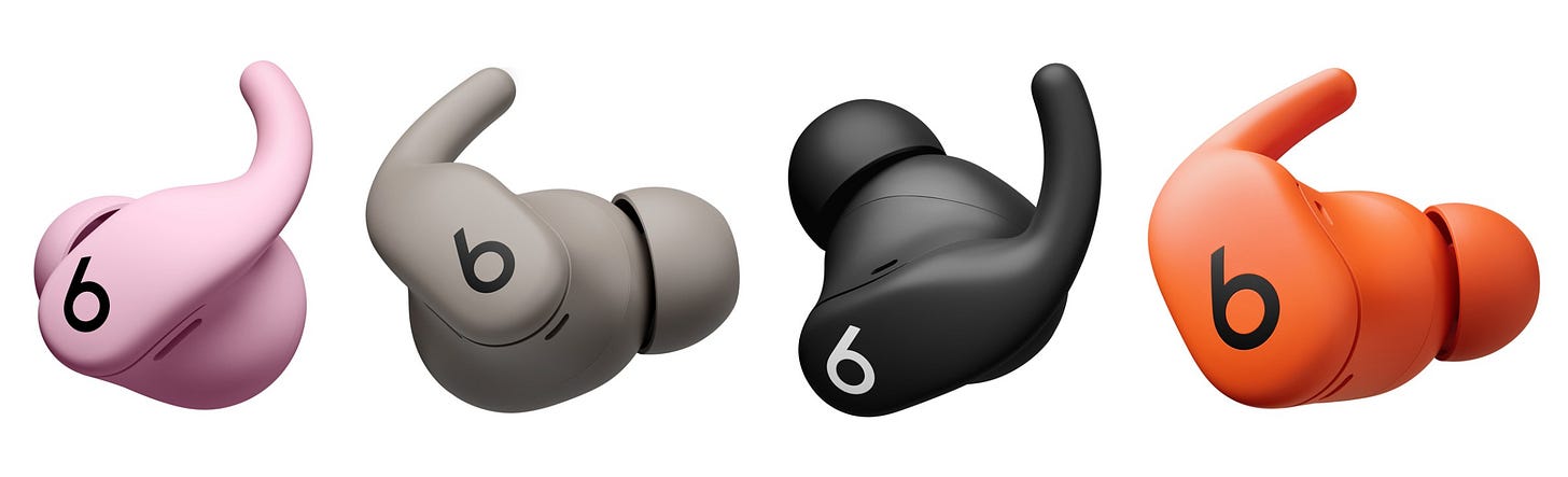 Four Beats Powerbeats Fit earbuds in different colors. Four Beats Powerbeats Fit earbuds in different colors.