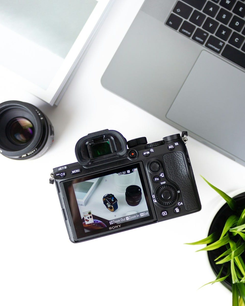 black bridge camera near laptop computer