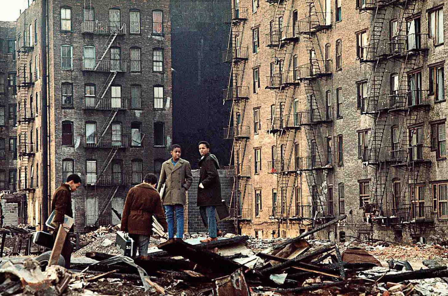 A lone figure walks past a dilapidated storefront, showcasing the tough reality of 70s New York. A lone figure walks past a dilapidated storefront, showcasing the tough reality of 70s New York.
