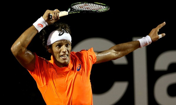 joao souza returns tennis serve to haider maurer rio open 2015 joao souza returns tennis serve to haider maurer rio open 2015