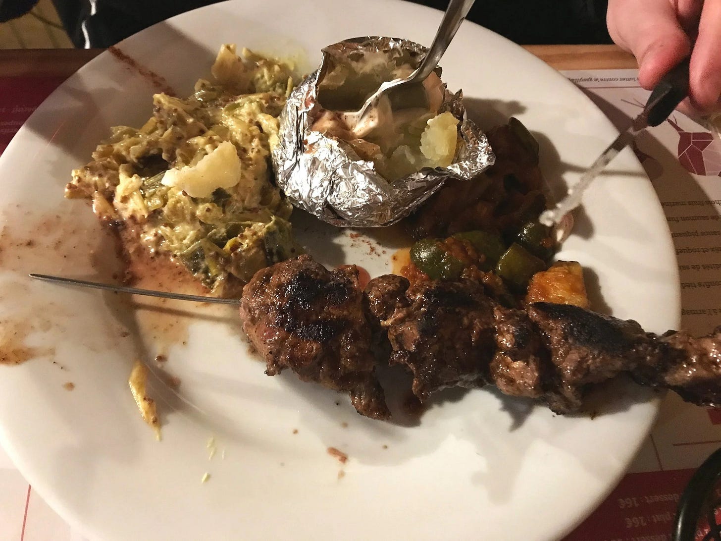  Half-finished kabob from Le May, a local restaurant in Toulouse, France 