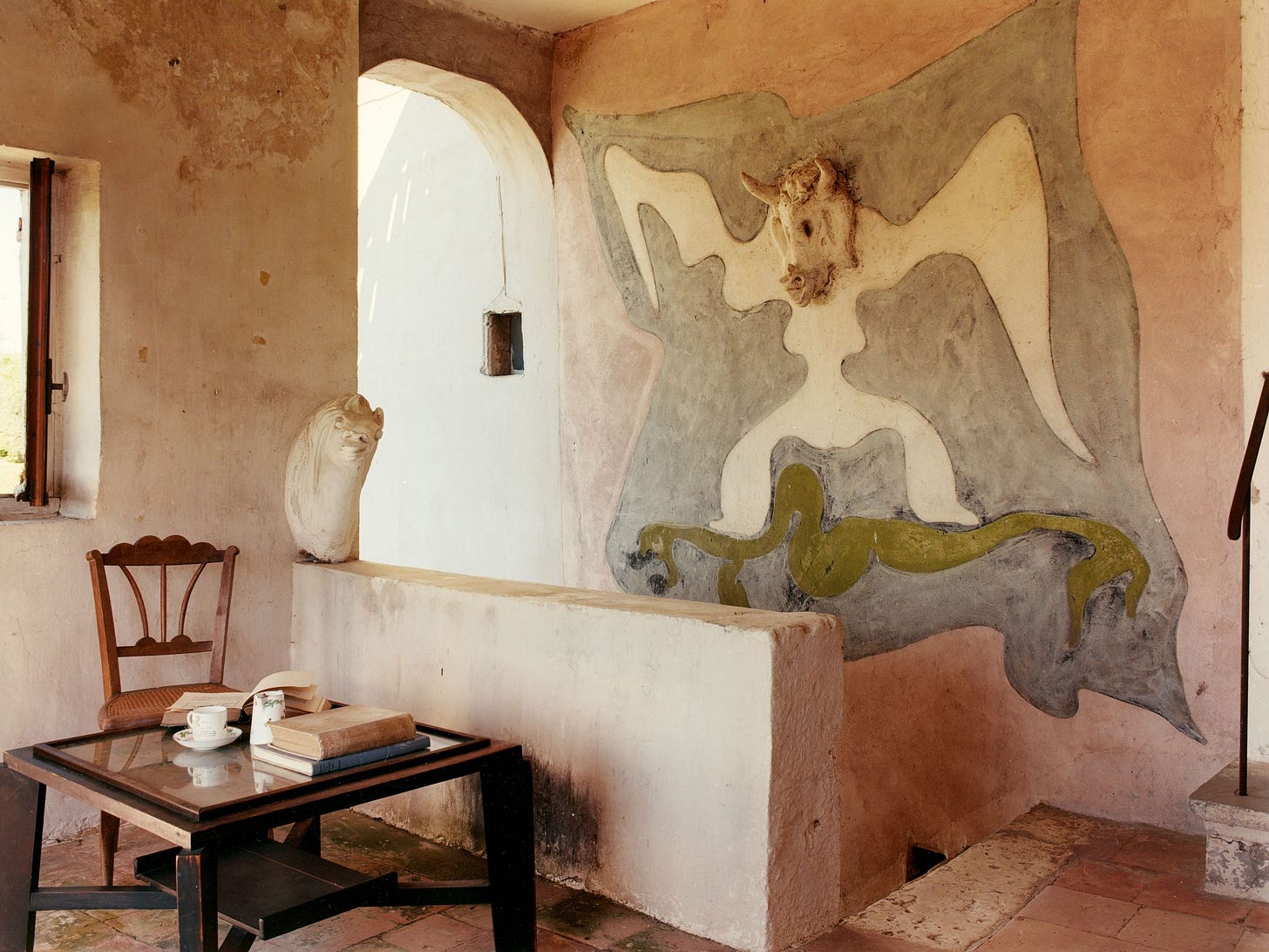 The terrace at Max Ernst and Leonora Carringtons farmhouse has a roof to protect it from the sun and a window to let in...