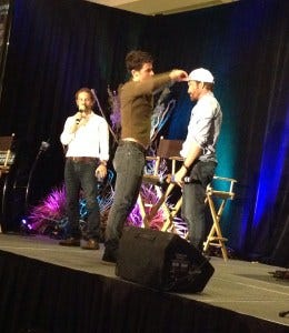 Matt fixes Rob's hat