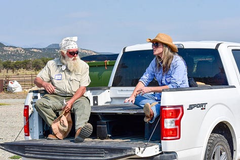 A gallery from the Redwing Ranch field day: attendees walking single-file across the grassland toward distant hills, a close-up portrait of a woman in a straw cowboy hat and sunglasses, and two people in conversation while seated on the open tailgate of a pickup truck.