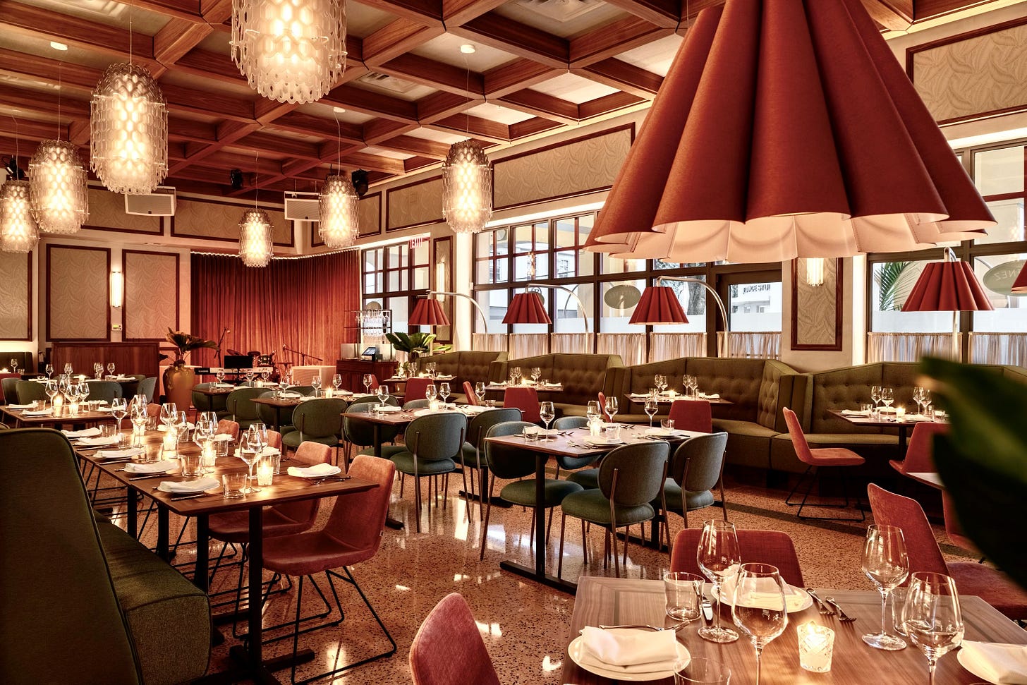 inside dining room of sra. martinez with green seats, pink couches, chandliers inside dining room of sra. martinez with green seats, pink couches, chandliers