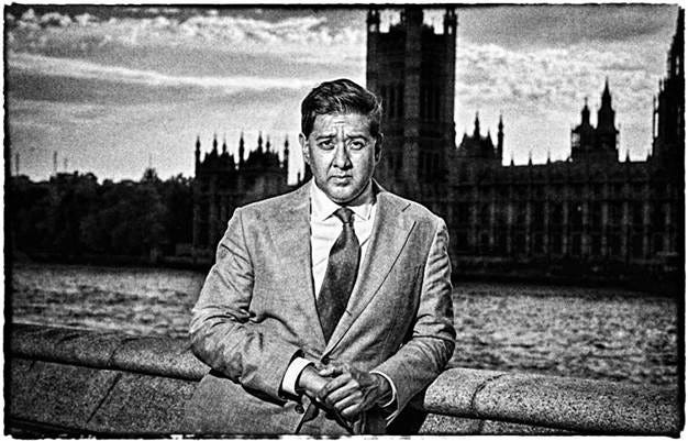 A person in a suit and tie

AI-generated content may be incorrect.