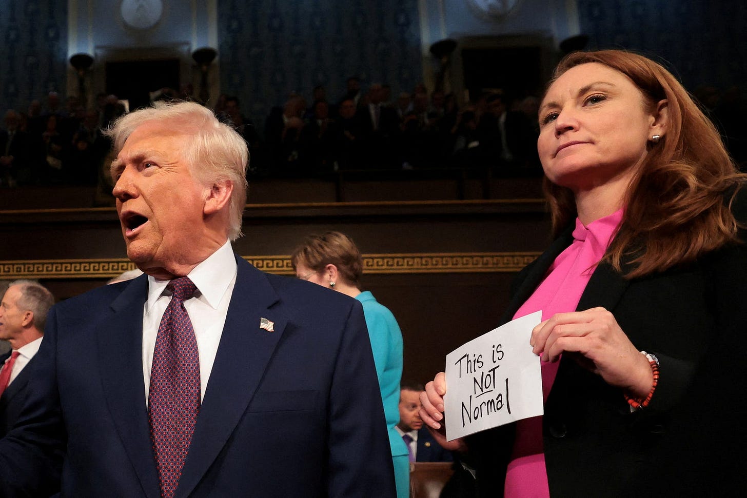 Democratic women wear pink to protest Donald Trump at speech