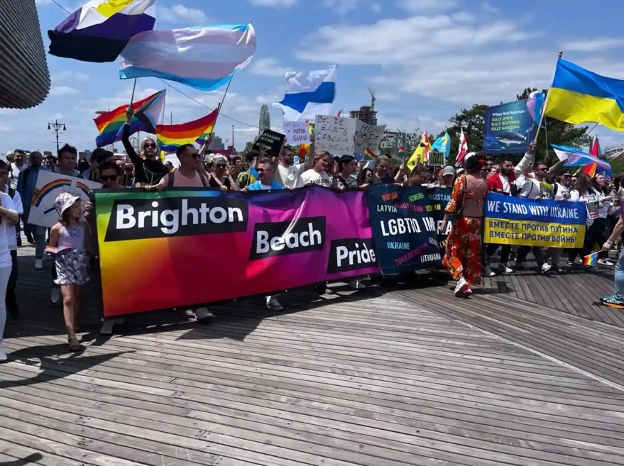A group of people holding signs

AI-generated content may be incorrect.