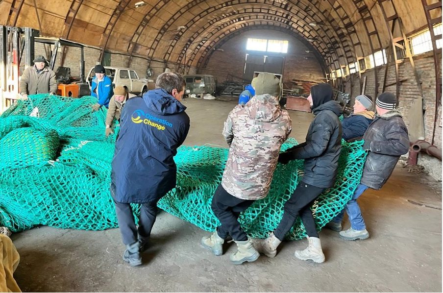 A load of fishing nets donated from Denmark being unloaded in Ukraine. A load of fishing nets donated from Denmark being unloaded in Ukraine.