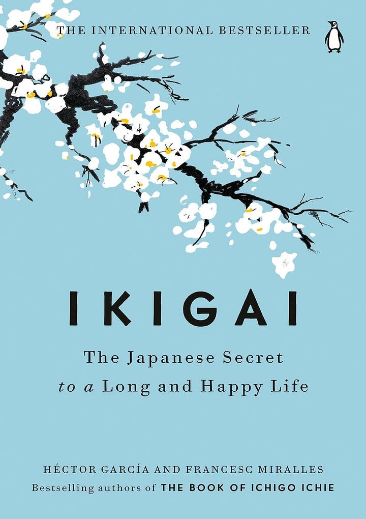 Book cover for Ikigai: The Japanese Secret to a Long and Happy Life by Héctor García and Francesc Miralles. The cover features a light blue background with an illustration of a cherry blossom branch with white flowers and yellow centers. The title is prominently displayed in bold black font, and the subtitle is written below in smaller black text. The Penguin Books logo is in the top right corner Book cover for Ikigai: The Japanese Secret to a Long and Happy Life by Héctor García and Francesc Miralles. The cover features a light blue background with an illustration of a cherry blossom branch with white flowers and yellow centers. The title is prominently displayed in bold black font, and the subtitle is written below in smaller black text. The Penguin Books logo is in the top right corner