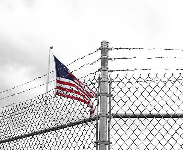 American Prison Stock Photo - Download Image Now - Detention Center, American  Flag, Barbed Wire - iStock