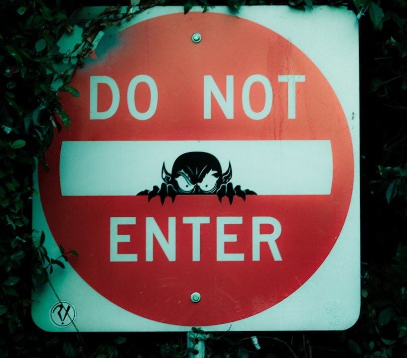 red and white Do Not Enter street sign
