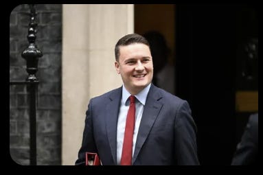 A person in a suit AI-generated content may be incorrect. A person in a suit AI-generated content may be incorrect.