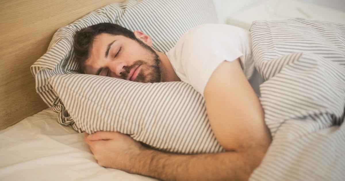 Man Sleeping on A Bed