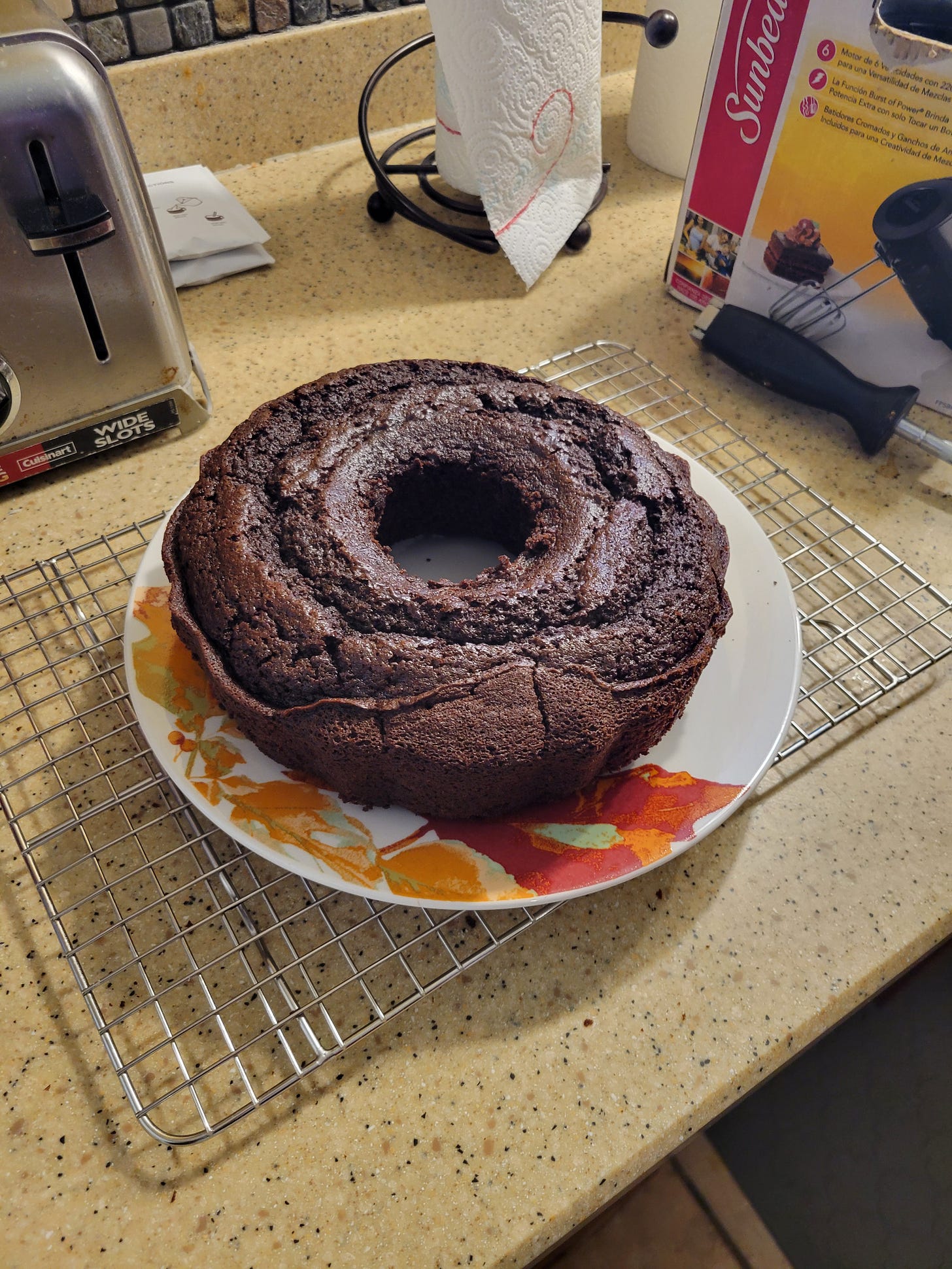 A cake on a fall leaf plate on a rack