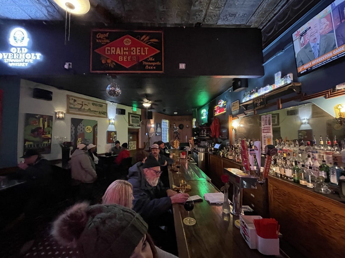 A group of people sitting at a bar

AI-generated content may be incorrect.