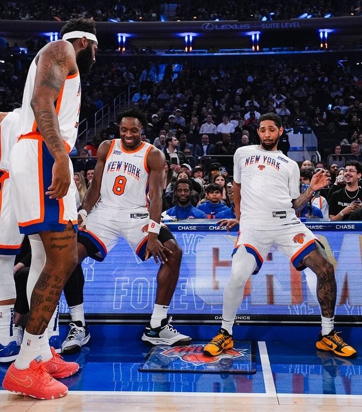 This may contain: the new york mets are playing basketball in front of an audience
