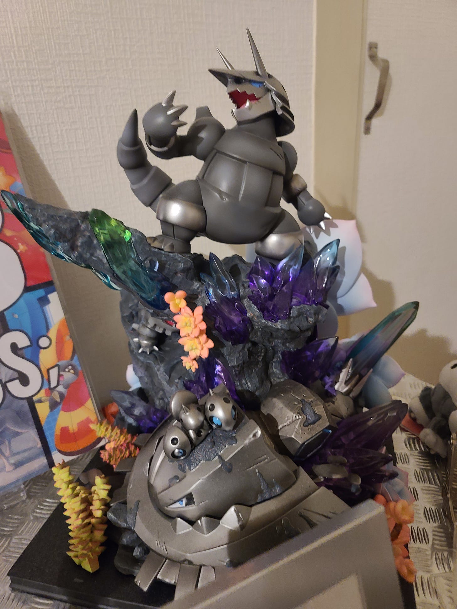 One of my favourite items from SteC's collection is this awesome Aggron statue, featuring Aron, Lairon, and Mega Steelix. It was produced by PC House Studio, and, while unofficial, I can’t help but love it. It looks so cool!