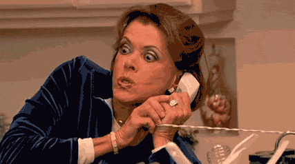 Lucille Bluth from Arrested Development angrily picking up the phone.