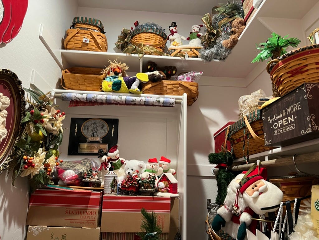 a closet filled with christmas decorations