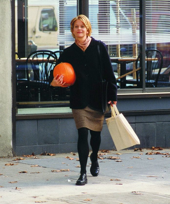 This may contain: the woman is walking down the street with her shopping bags and an orange ball in her hand