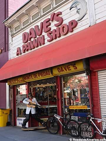 Elvis statue suggests that this is not a normal pawn shop. Elvis statue suggests that this is not a normal pawn shop.