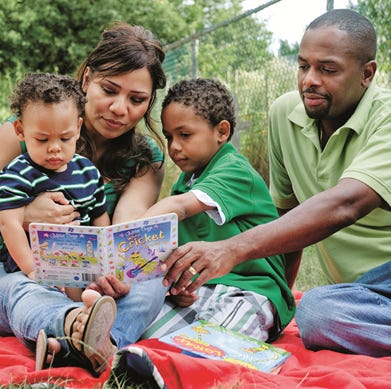 family-reading-with-children-parents