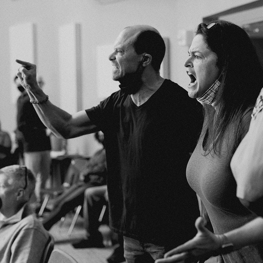 May be a black-and-white image of 2 people, people standing and indoor May be a black-and-white image of 2 people, people standing and indoor