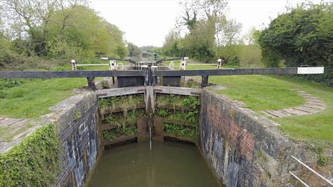 Locks on the Kennet and Avon Canal near Rowde. This is part of the Caen Hill flight of 29 locks. A narrowboat is just leaving heading in the direction of Trowbridge, Bradford on Avon and Bath. Images: Roland Millward