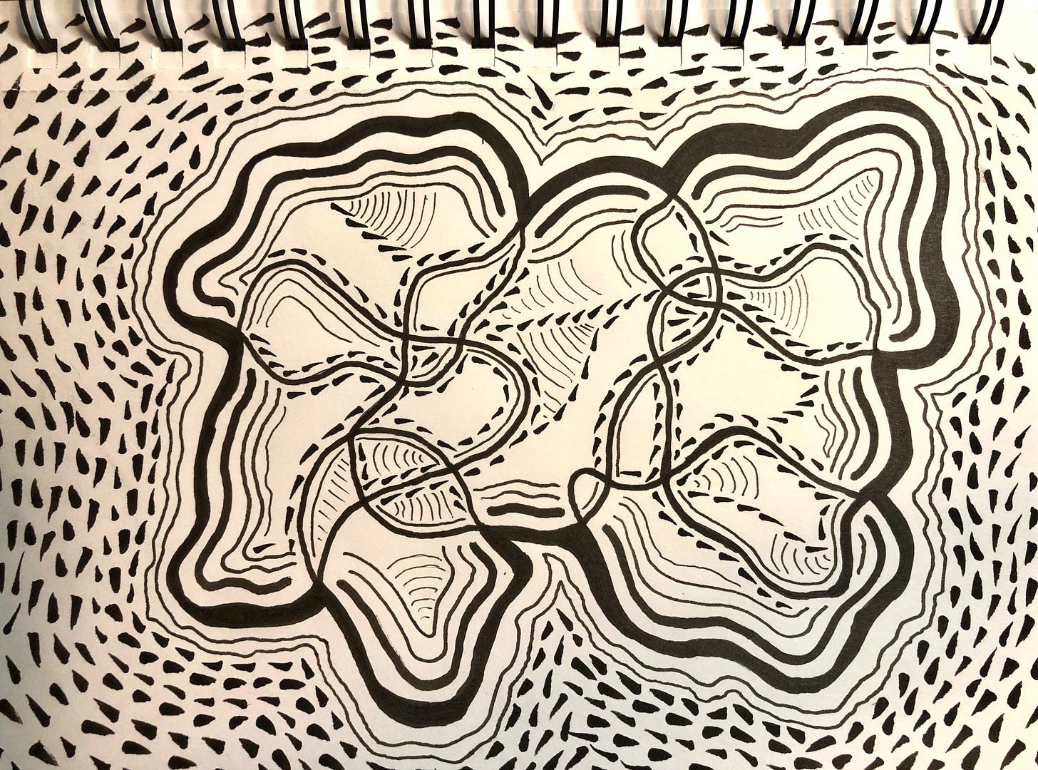 Black and white line drawing on sketch paper featuring two central organic forms surrounded by radiating wavy lines and dotted textures, creating a rhythmic, topographical map-like appearance.