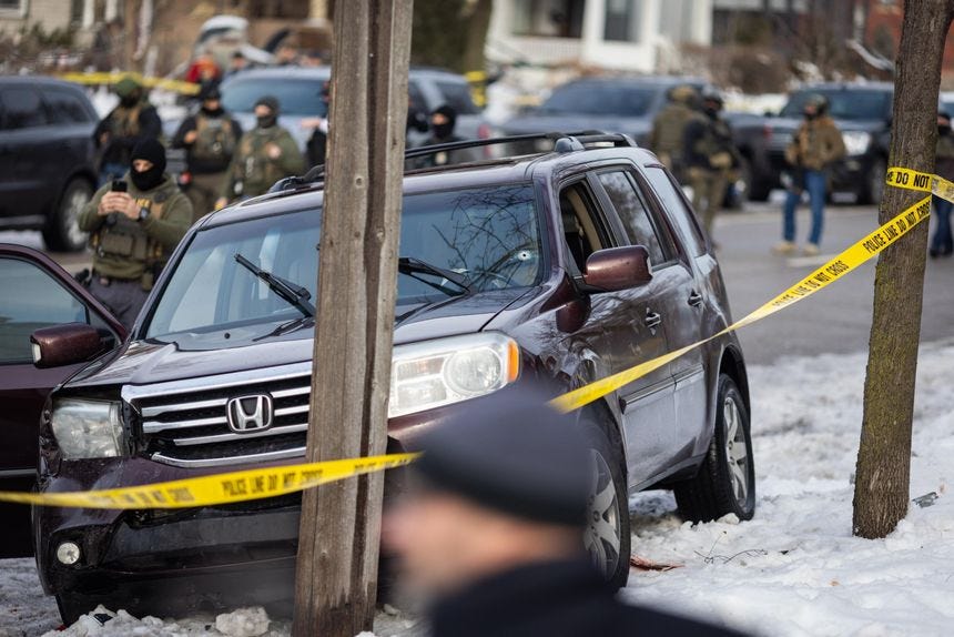 A bullet hole is visible in the windshield of a crashed vehicle on Portland Avenue in Minneapolis after an ICE officer shot and killed an observer on Wednesday, Jan. 7, 2026.