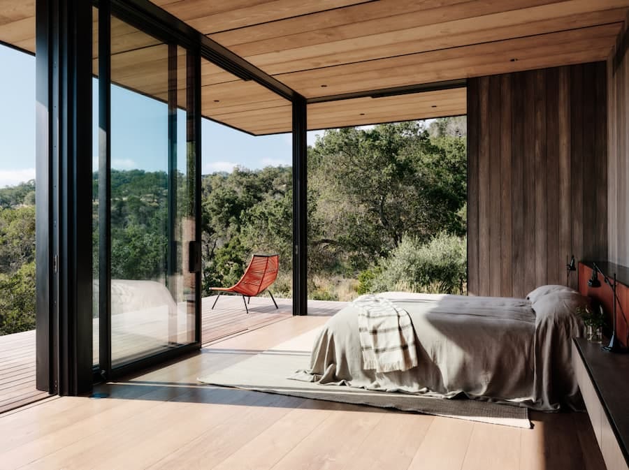 modern bedroom with large bifold doors as windows modern bedroom with large bifold doors as windows