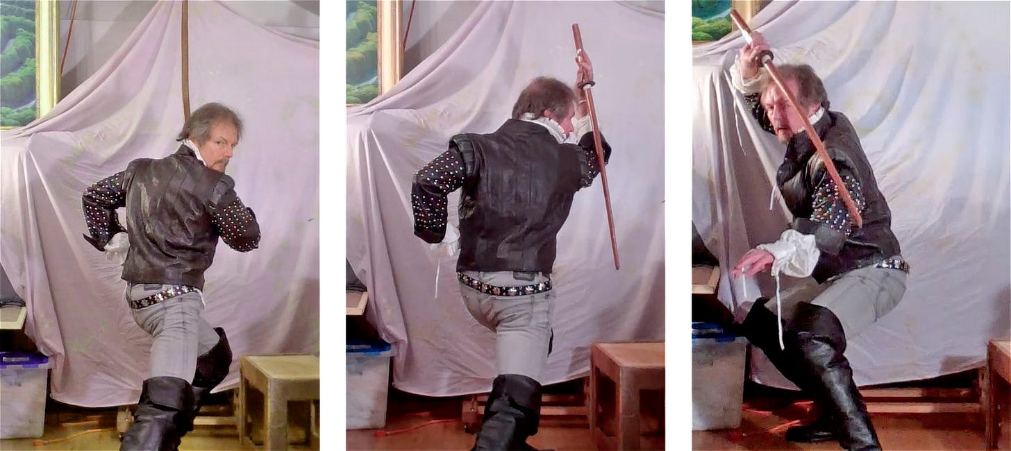 Three photos of the artist in studded leather jacket and knee high boots. He holds a wooden bokken in each. The left and center photo have him facing away in a lunge forward. The first his sword is up in front of him. The second his sword is held pommel up extending down behind his arm. The last photo he faces the audience in angled profile with sword up and extending on an angle across his body. His free hand is out exposing the white fancy cuff of the shirt beneath.