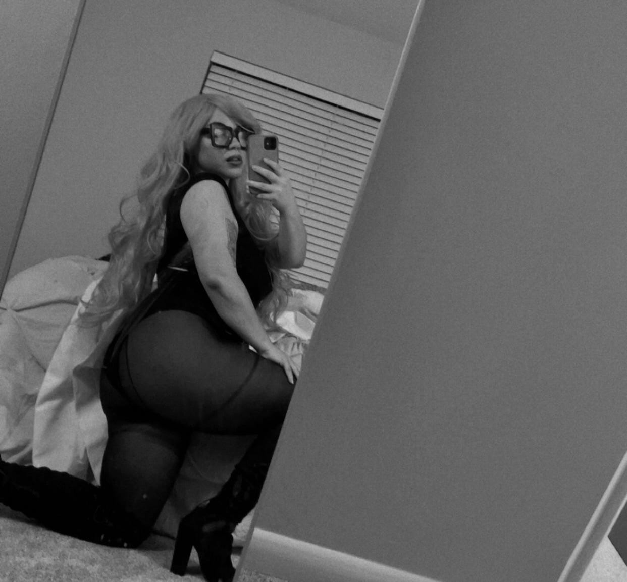 May be a black-and-white image of 1 person, tights, fishnet stockings and text