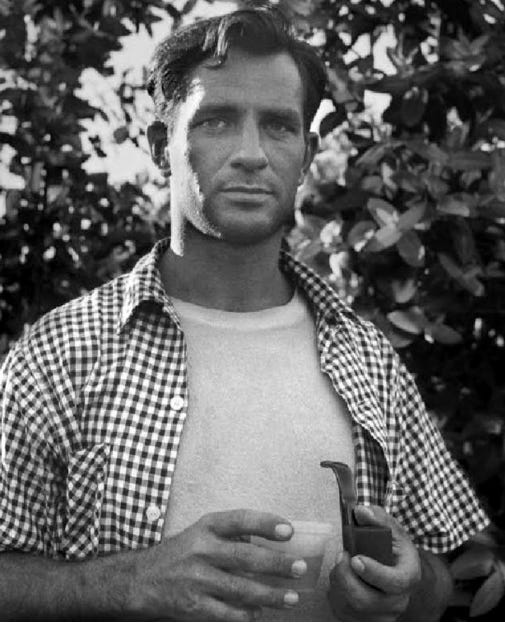 A person holding a pipe and a cup

Description automatically generated