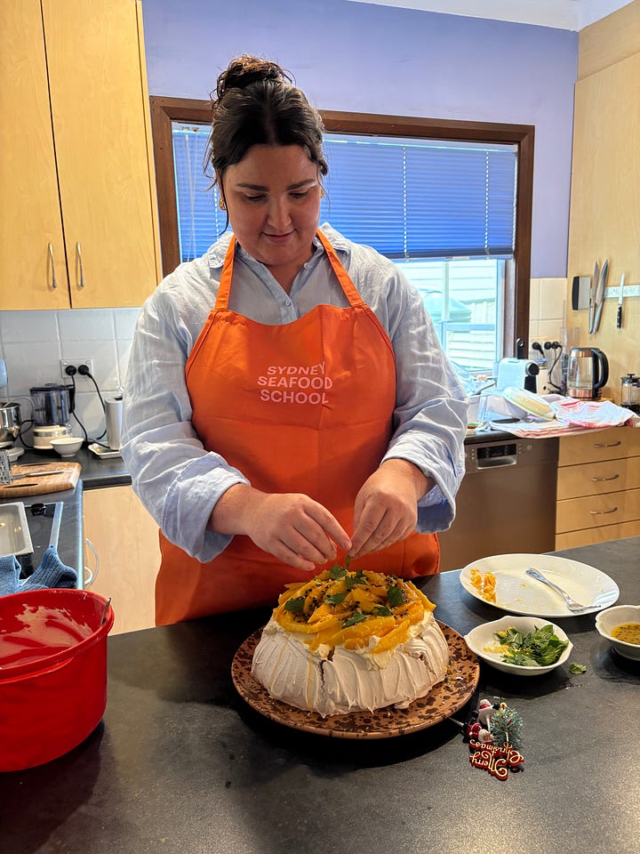 Christmas food and woman making a pavlova