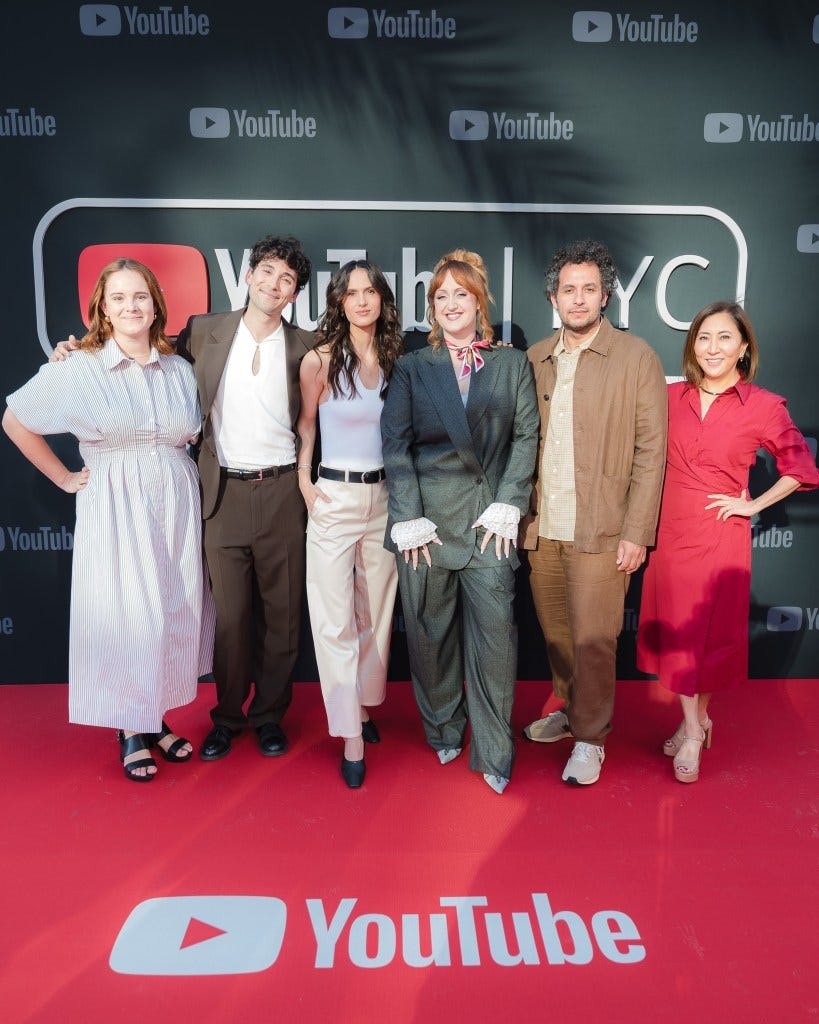 Katey Rich, Julian Shapiro-Barnum, Cleo Abram, Brittany Broski, Kareem Rahma, and Janice Min in front of a YouTube FYC backdrop