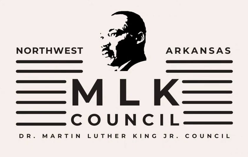 May be a graphic of text that says 'NORTHWEST ARKANSAS EM L LKE 三MLK三 K COUNC COUNCIL DR. MARTIN LUTHER KING JR. COUNCIL'