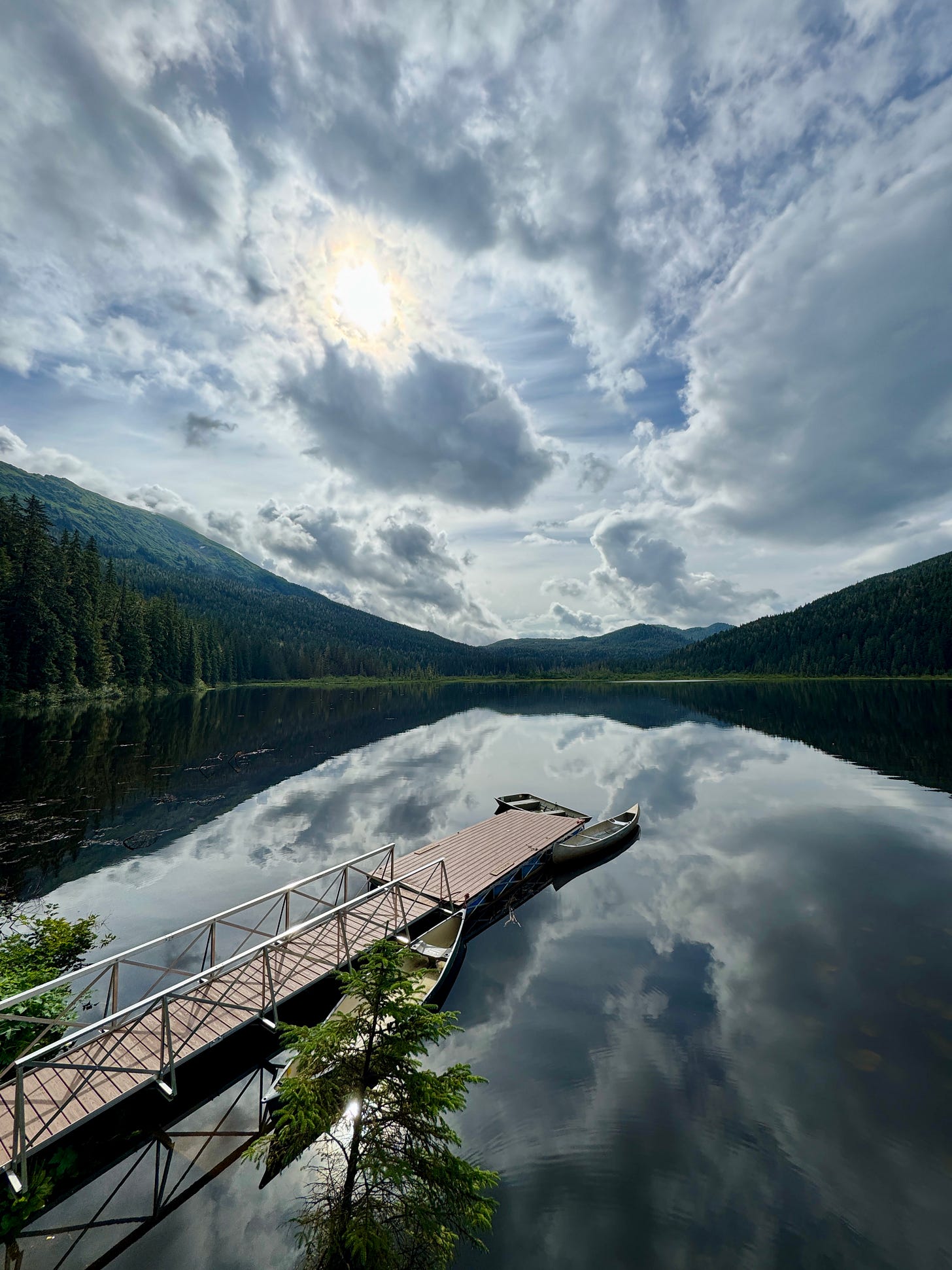 Lake in Alaska, dock, canoes Lake in Alaska, dock, canoes