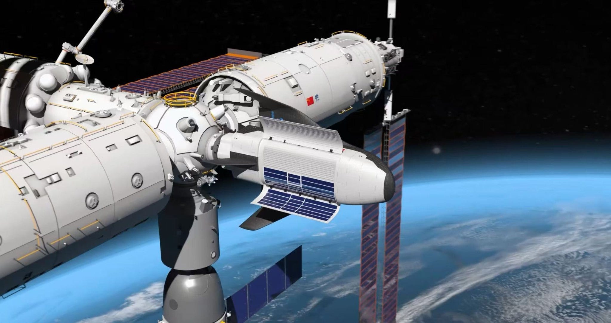 A render of the Haolong cargo spaceplane docked to the Tiangong Space Station at Tianhe’s forward docking port. A render of the Haolong cargo spaceplane docked to the Tiangong Space Station at Tianhe’s forward docking port.
