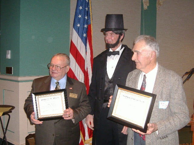 President Lincoln stayed long enough to honor two 'Republican of the Year' men. With their plaques, on the left is Blan Harcum and on the right is Bob Miller. President Lincoln stayed long enough to honor two 'Republican of the Year' men. With their plaques, on the left is Blan Harcum and on the right is Bob Miller.