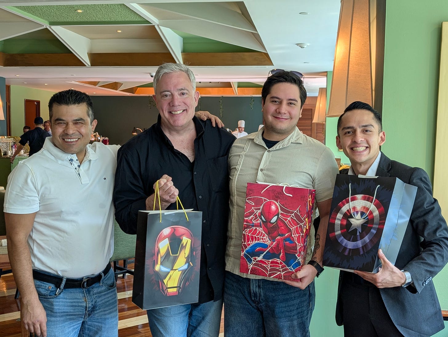 Four men celebrating birthdays